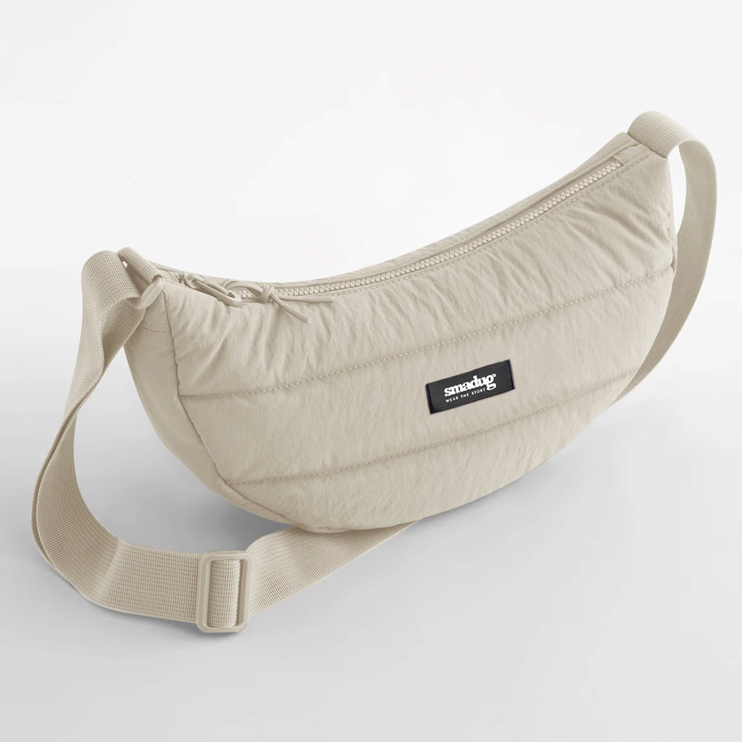 Beige waist bag with a strap on a white background